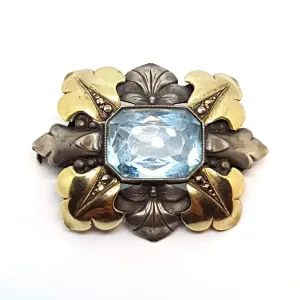 Art deco brooch. Silver pin made of silver, views of gold and simile of aquamarine.